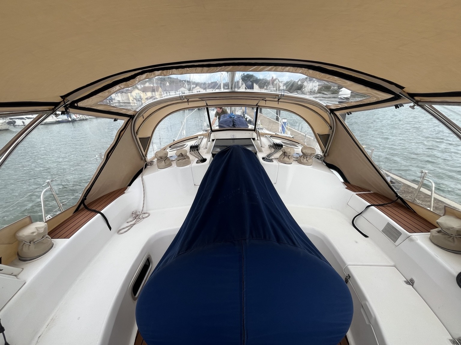Looking forward through the clear windows of a beige cockpit enclosure