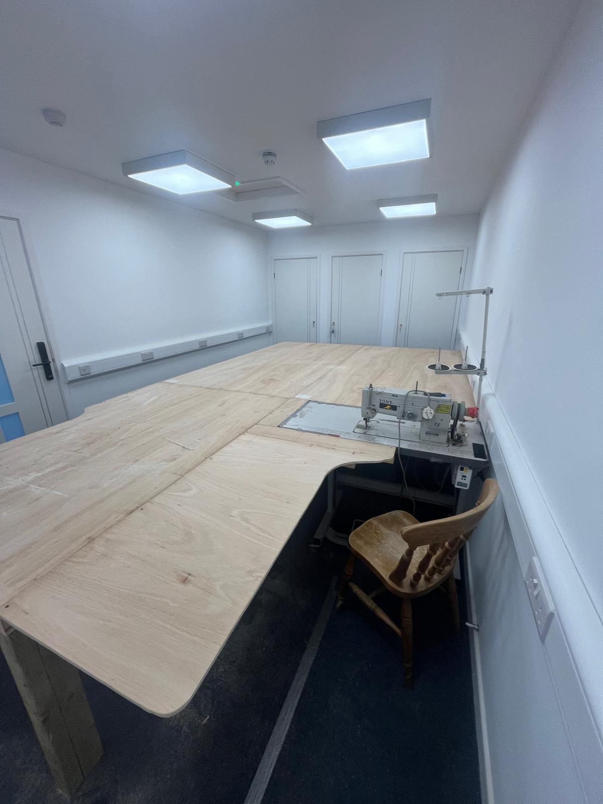 Completed sewing table with an industrial sewing machine at Sea Jay's Pwllheli satellite unit