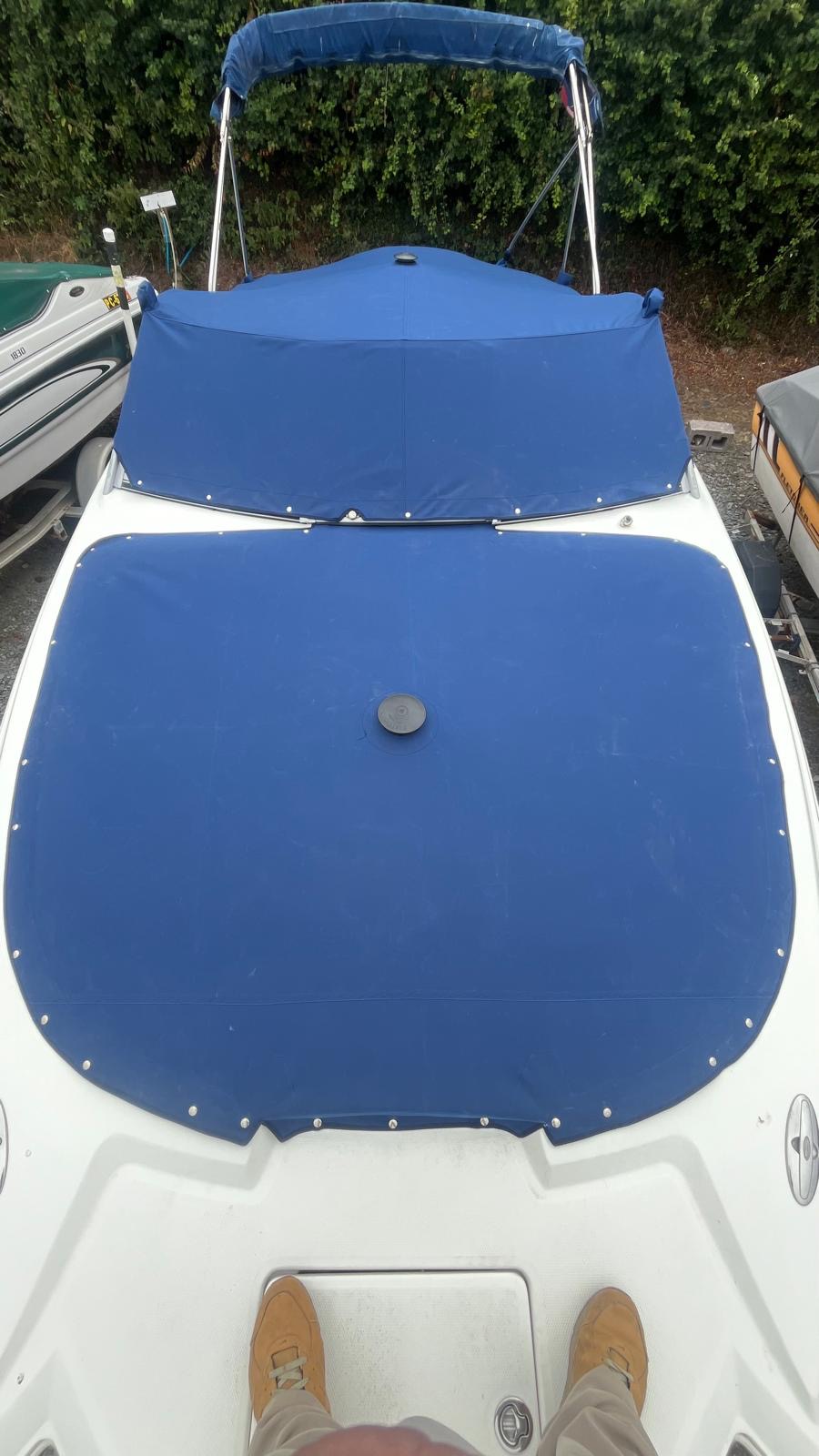 New blue made-to-measure boat cover after replacement