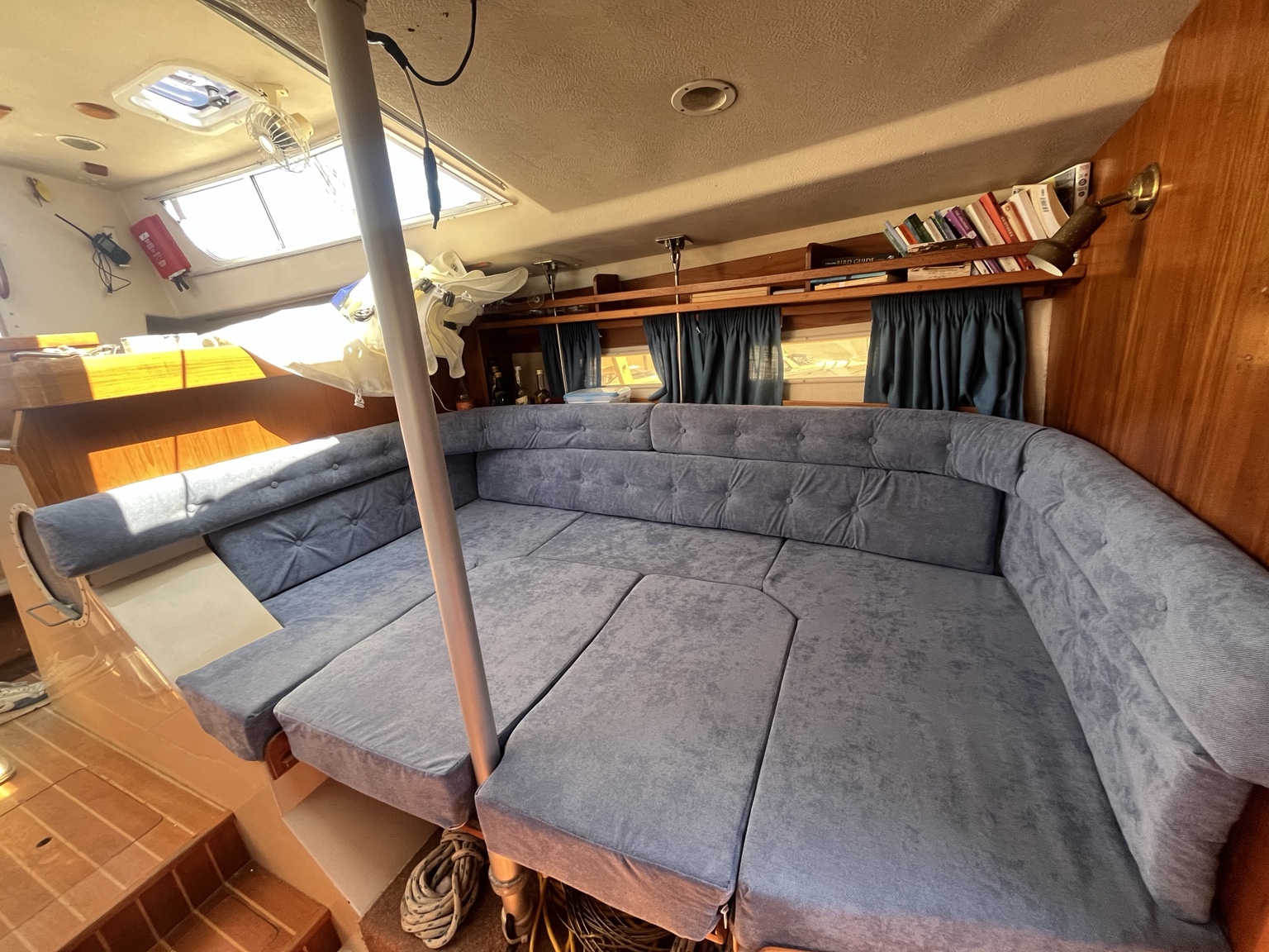 New made-to-measure blue saloon upholstery and berth infill on a sailing boat